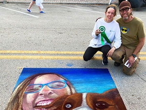 Posing with girl with australian shepherd corgi dog chalk art