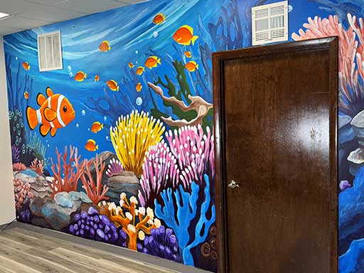 Wall mural featuring underwater coral and clownfish