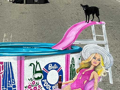 Dog posing with 3D painted image of Ken and Barbie dolls in Pool Party set